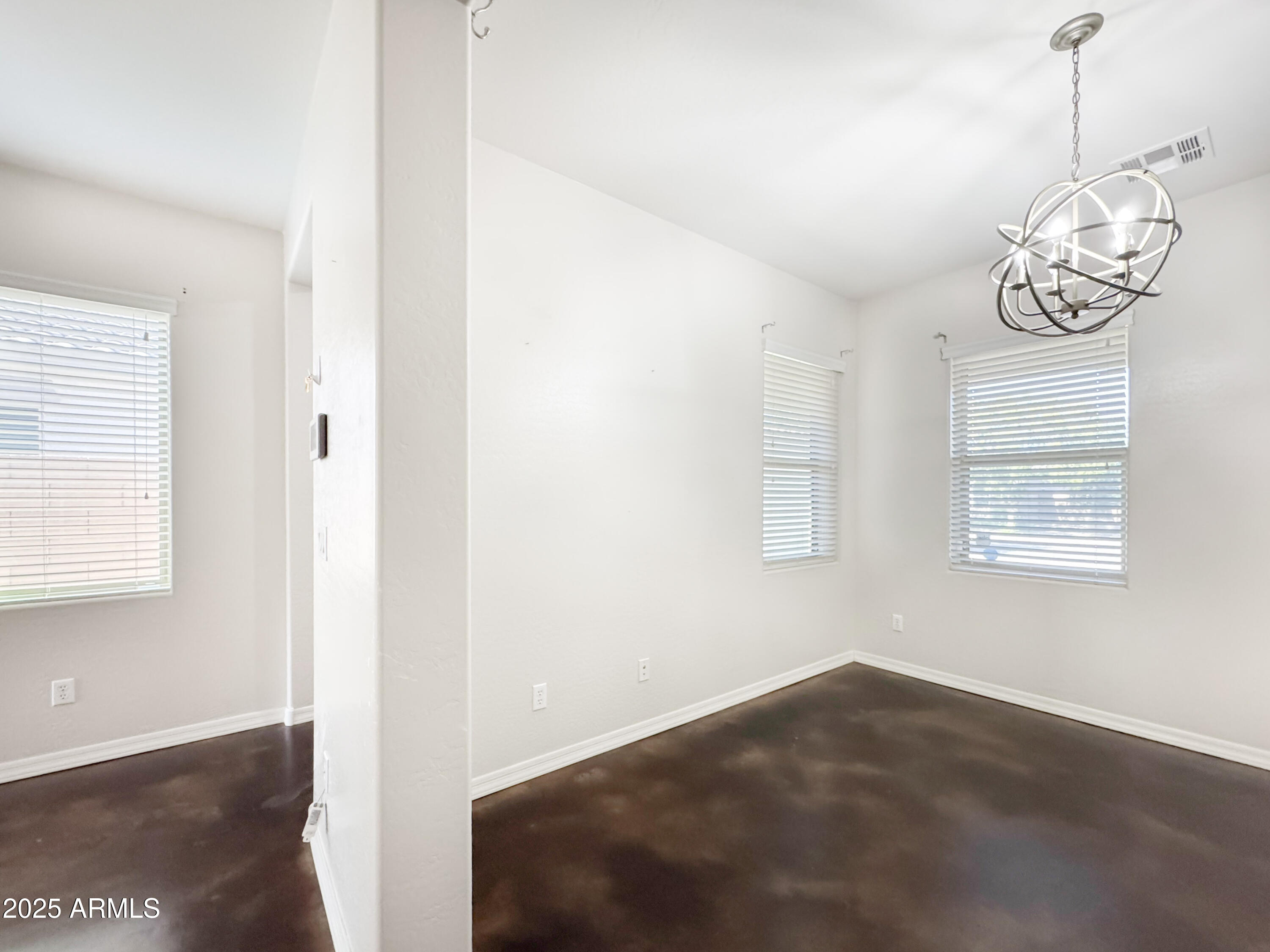 3141 East Patrick Street Gilbert, AZ 85295 - Photo 9 of 32 a view of a room with wooden floor and windows