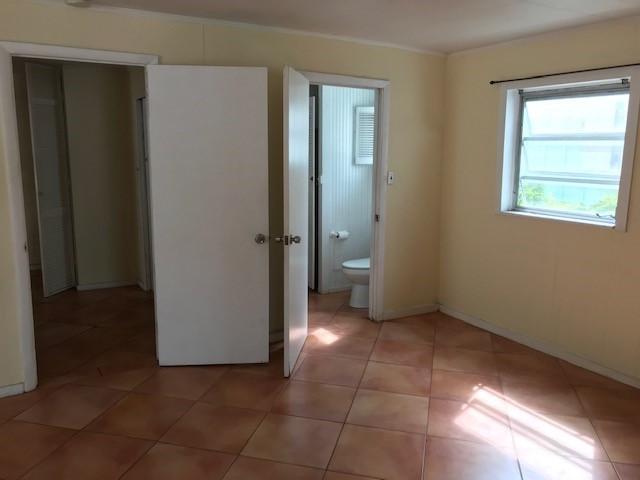 1320 Virginia Street Key West, FL 33040 - Photo 5 of 11 a bathroom with a toilet