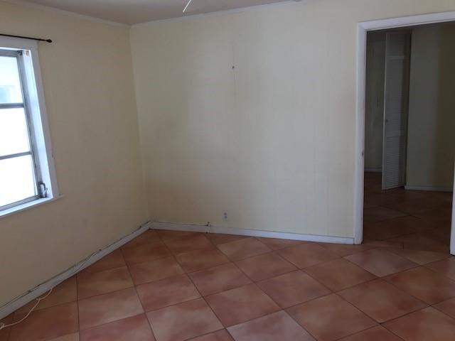 1320 Virginia Street Key West, FL 33040 - Photo 6 of 11 an empty room with a window