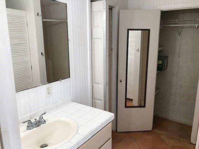 1320 Virginia Street Key West, FL 33040 - Photo 9 of 11 a bathroom with a sink and a mirror