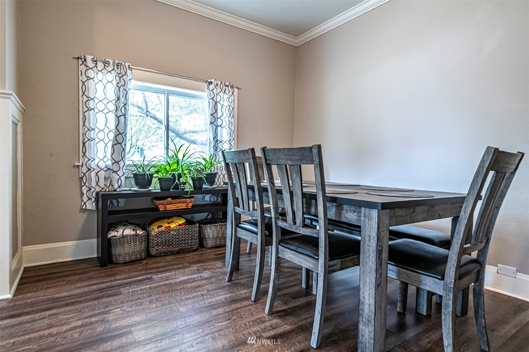152 Locust Street Walla Walla, WA 99362 - Photo 11 of 38 a view of a dining room with furniture and a potted plant