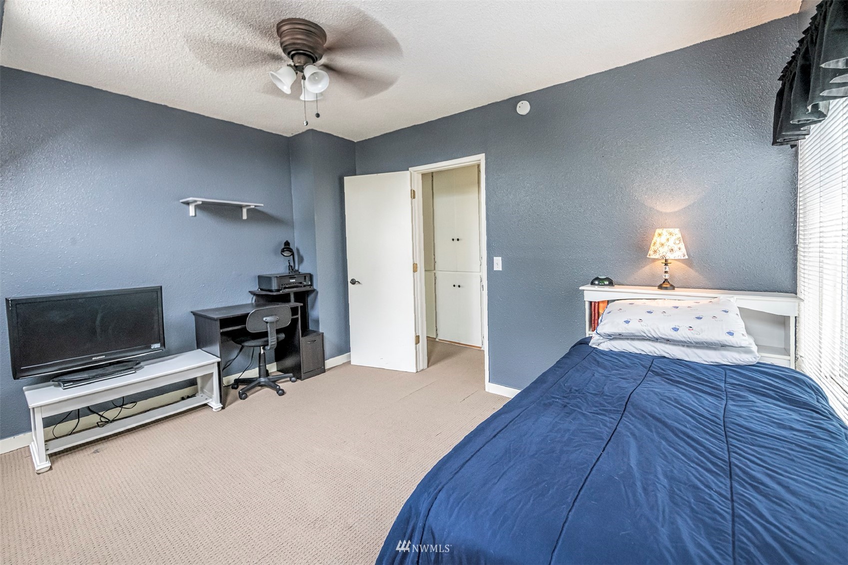 152 Locust Street Walla Walla, WA 99362 - Photo 24 of 38 a bedroom with furniture and a chandelier