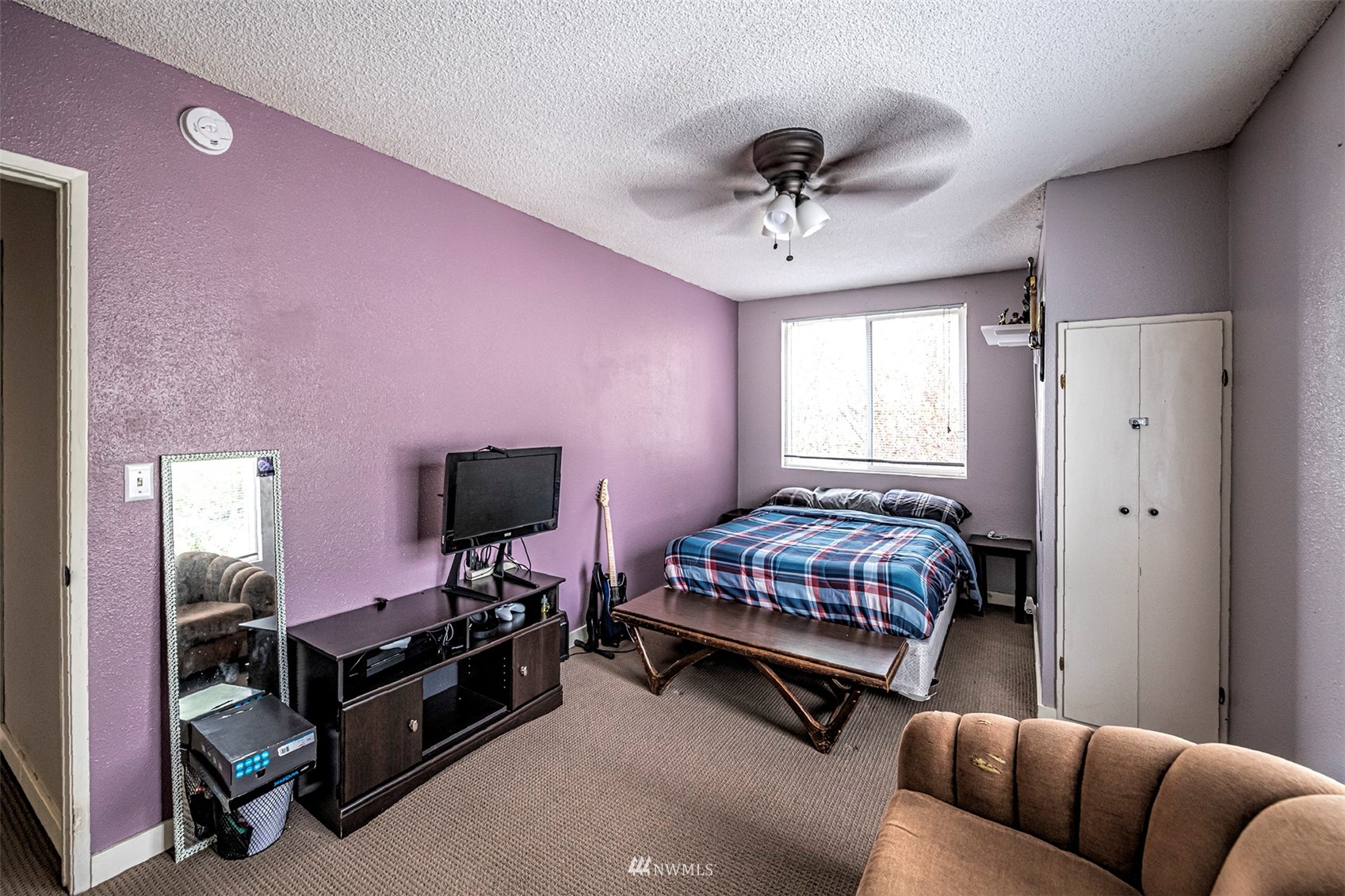 152 Locust Street Walla Walla, WA 99362 - Photo 27 of 38 a bedroom with a bed and a chandelier