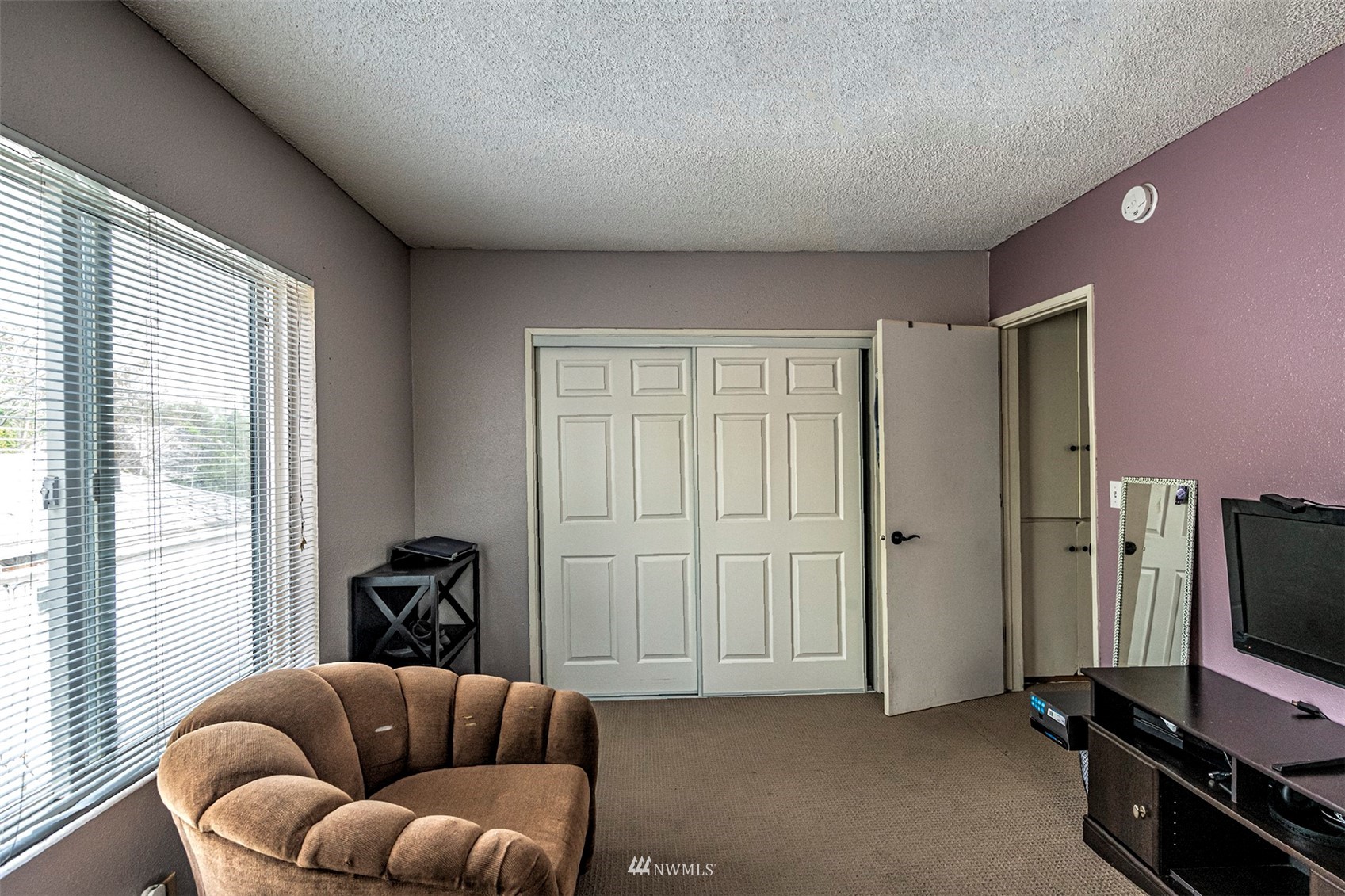 152 Locust Street Walla Walla, WA 99362 - Photo 28 of 38 a living room with furniture a flat screen tv and a window