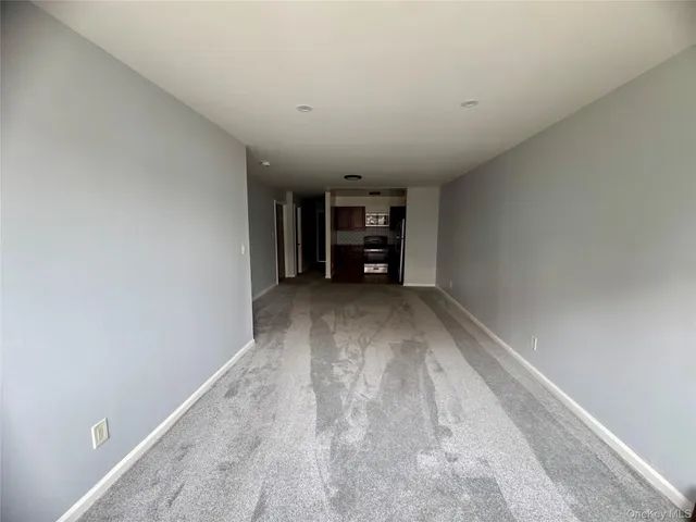 a kitchen with a refrigerator and a sink