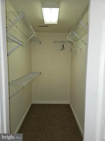 a view of a room with racks on the wall