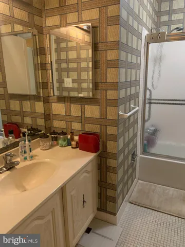 a bathroom with a sink and a shower