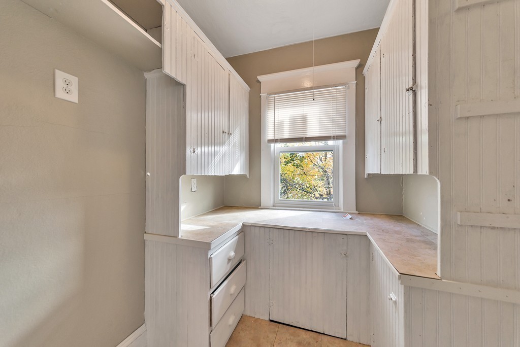 17-19 Standish Street Springfield, MA 01108 - Photo 12 of 20 a view of kitchen and hallway with wooden floor