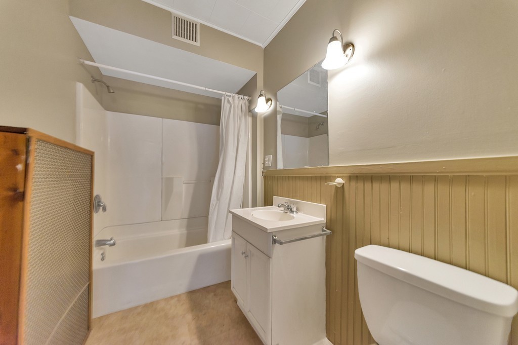 17-19 Standish Street Springfield, MA 01108 - Photo 13 of 20 a bathroom with a sink a toilet and shower