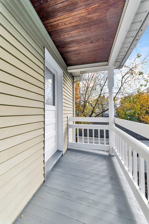 17-19 Standish Street Springfield, MA 01108 - Photo 18 of 20 a view of a balcony with wooden floor