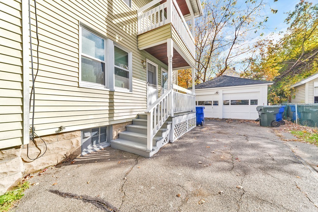 17-19 Standish Street Springfield, MA 01108 - Photo 19 of 20 a view of a house with a patio and a yard