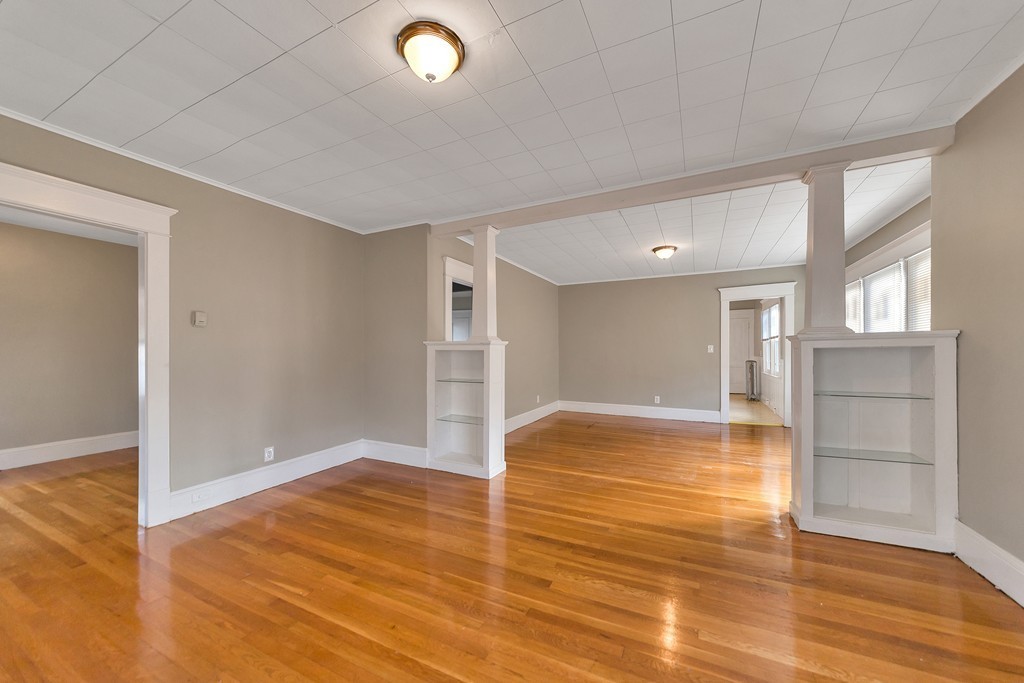 17-19 Standish Street Springfield, MA 01108 - Photo 6 of 20 a view of empty room with wooden floor