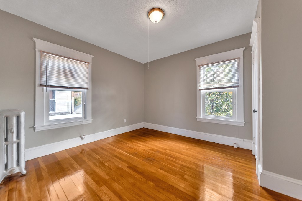 17-19 Standish Street Springfield, MA 01108 - Photo 7 of 20 a view of an empty room with a window