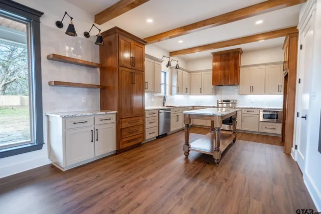 a room with cabinets and wooden floor