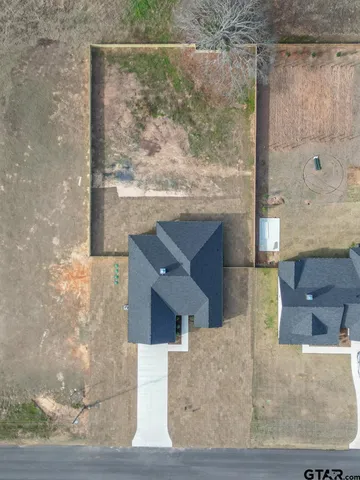 a house with trees in the background