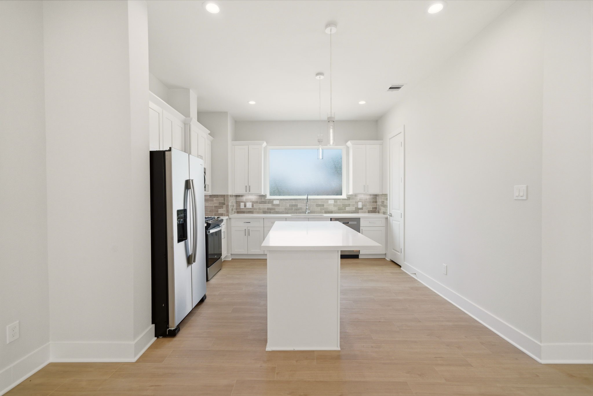 1398 Cedar Post Lane Houston, TX 77080 - Photo 14 of 33 a view of a kitchen with a refrigerator and a sink