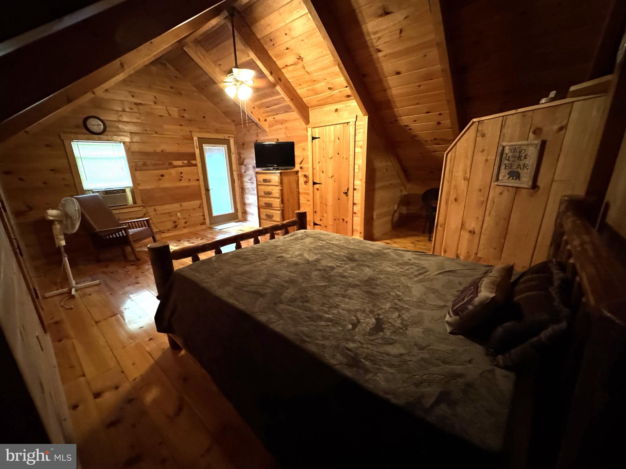 56 Ponderosa Way Milroy, PA 17063 - Photo 27 of 55 a bedroom with a bed and wooden floor