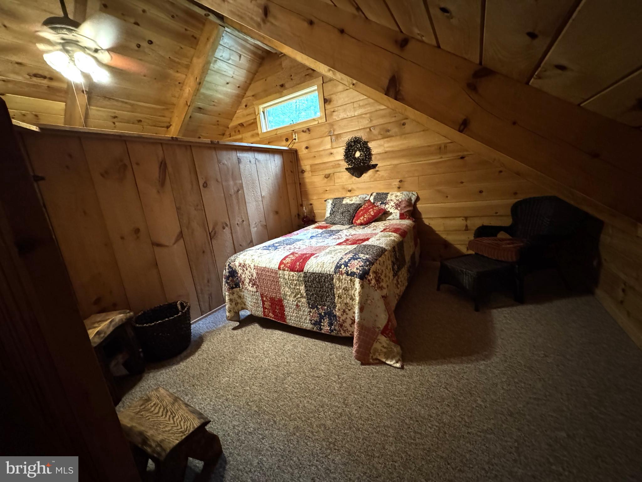 56 Ponderosa Way Milroy, PA 17063 - Photo 35 of 55 a bed sitting in a bedroom next to a window