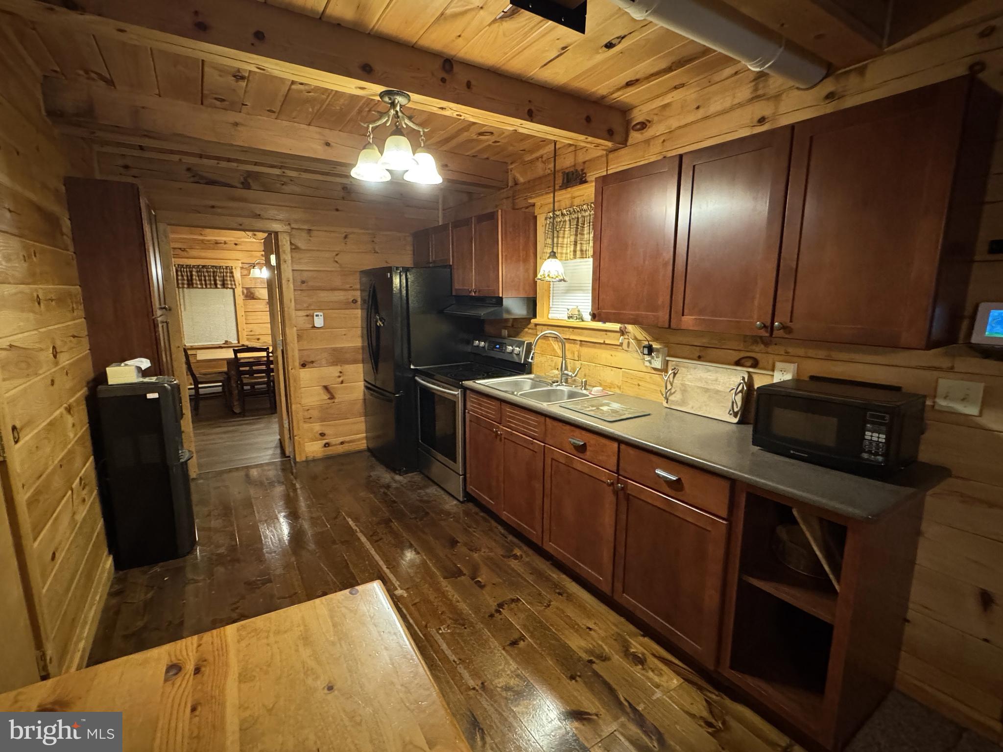 56 Ponderosa Way Milroy, PA 17063 - Photo 6 of 55 a large kitchen with stainless steel appliances wooden cabinets and a stove top oven
