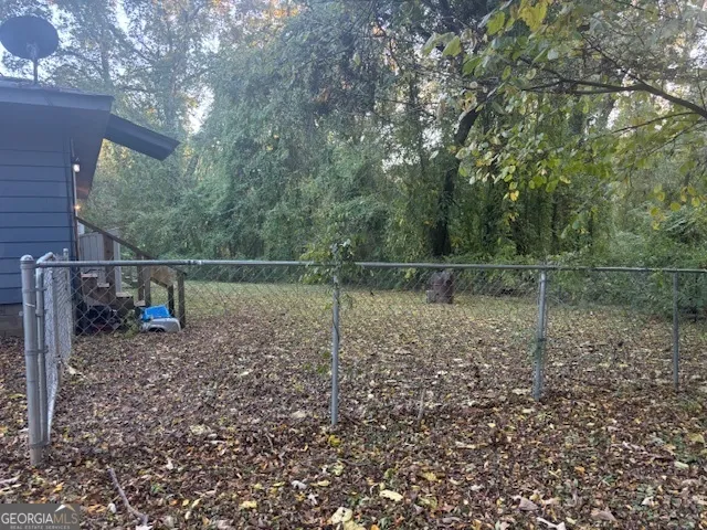 a backyard of a house with lots of green space