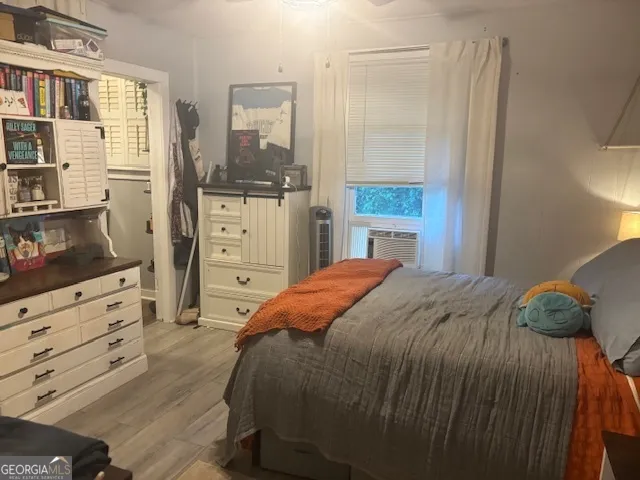 a bedroom with a bed and a dresser