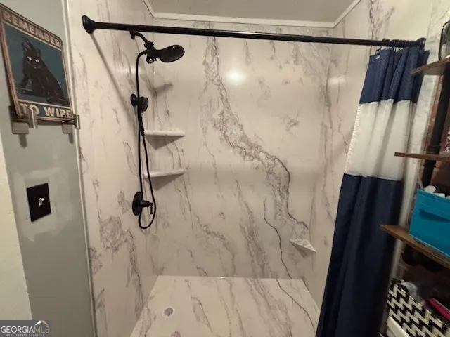 a bathroom with a shower and a tub