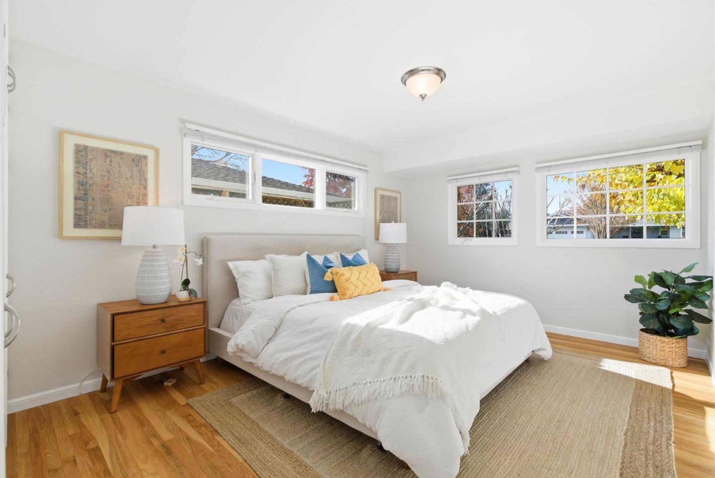 1747 Walnut Drive Mountain View, CA 94040 - Photo 23 of 38 a bedroom with a bed and a potted plant