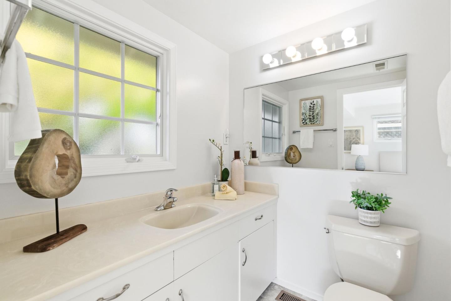 1747 Walnut Drive Mountain View, CA 94040 - Photo 25 of 38 a bathroom with a sink and a mirror