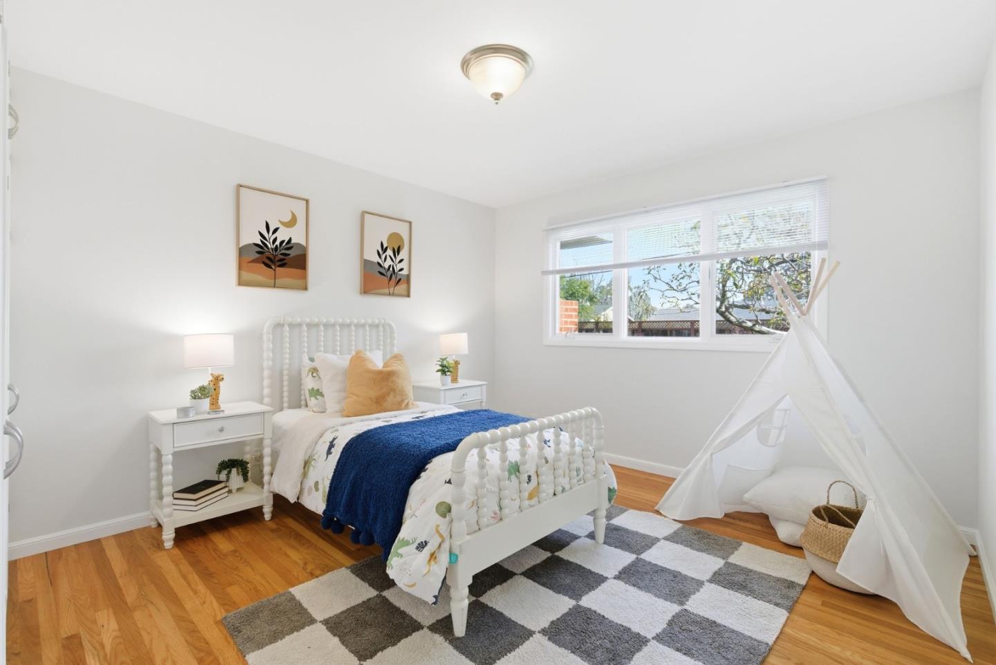 1747 Walnut Drive Mountain View, CA 94040 - Photo 27 of 38 a bedroom with a bed and wooden floor