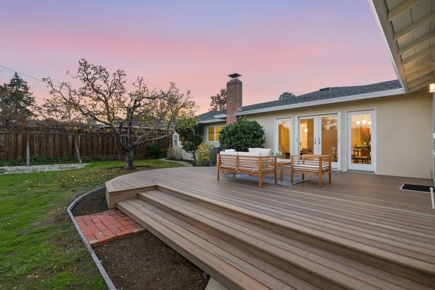 1747 Walnut Drive Mountain View, CA 94040 - Photo 4 of 38 a view of a chair and tables in the backyard of the house