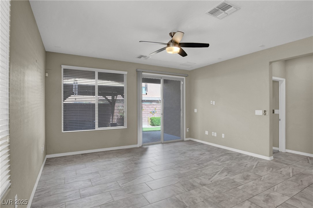 10976 Bluebell Basin Road Las Vegas, NV 89179 - Photo 15 of 40 Empty room featuring ceiling fan and baseboards