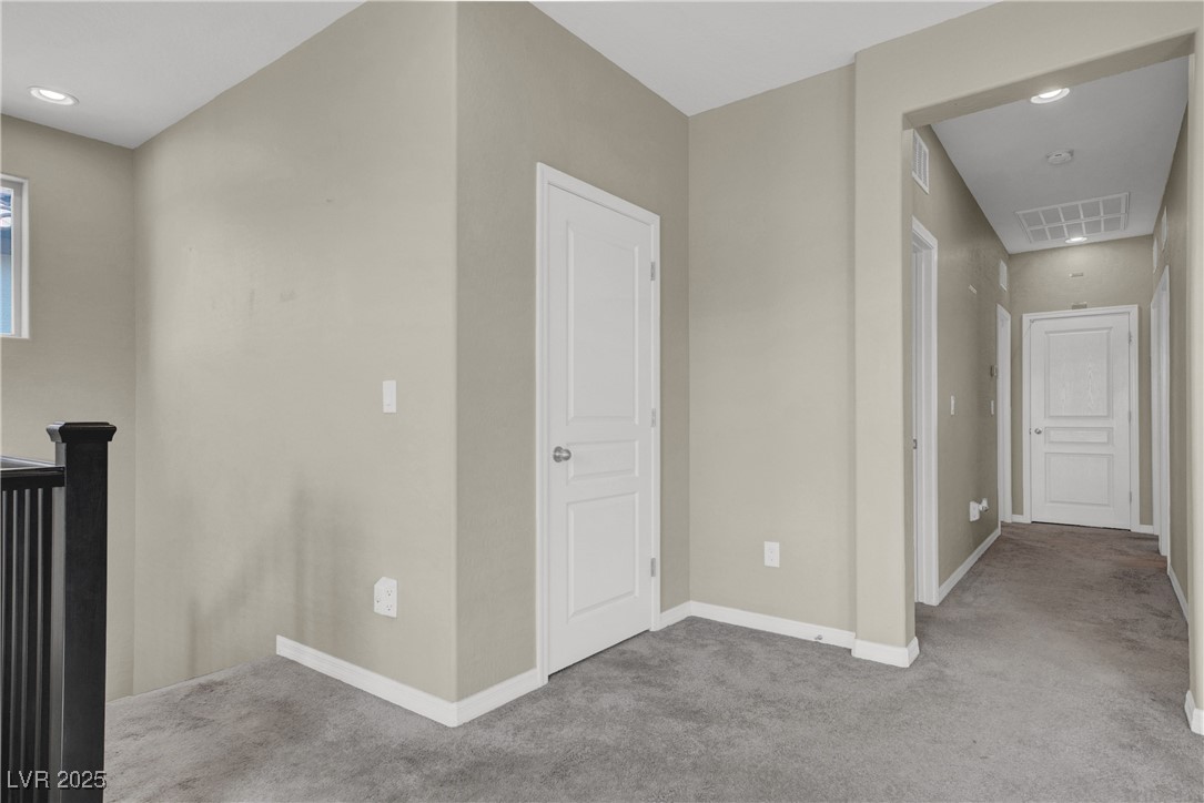 10976 Bluebell Basin Road Las Vegas, NV 89179 - Photo 25 of 40 Corridor featuring carpet floors, baseboards, and an upstairs landing