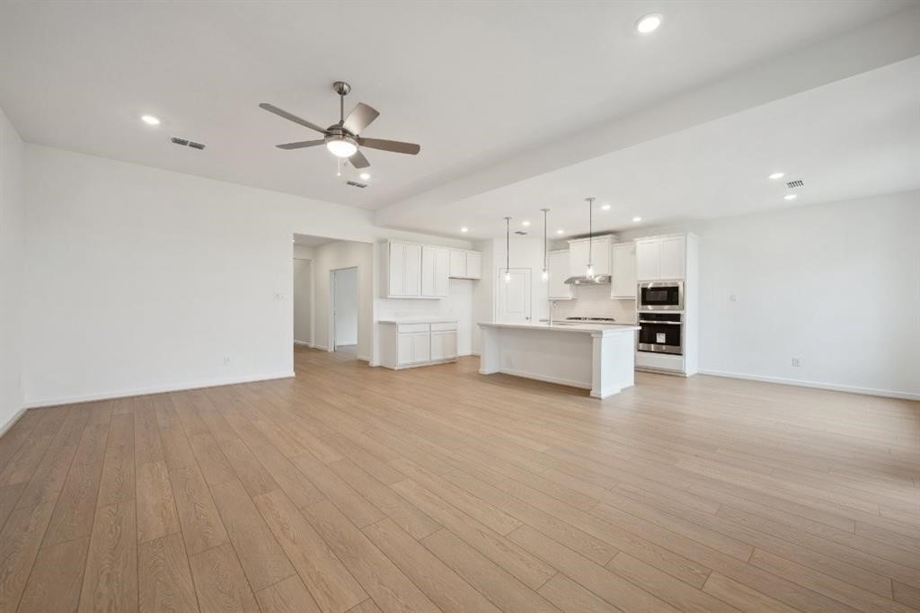 21918 Wycombe Terrace Way Cypress, TX 77433 - Photo 11 of 43 a view of a kitchen with a sink and a refrigerator