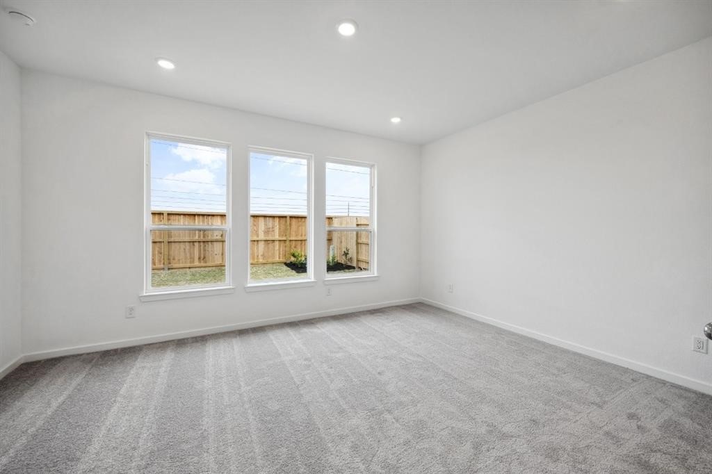 21918 Wycombe Terrace Way Cypress, TX 77433 - Photo 12 of 43 a view of an empty room with a window
