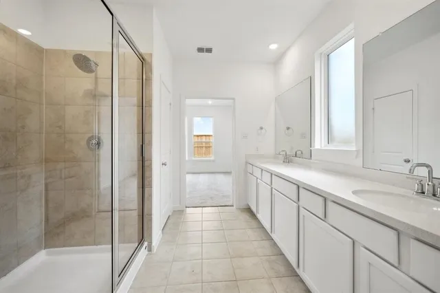 a view of an empty room and wooden floor