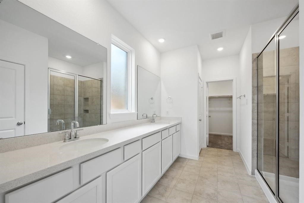 21918 Wycombe Terrace Way Cypress, TX 77433 - Photo 16 of 43 a bathroom with a double vanity sink mirror and double