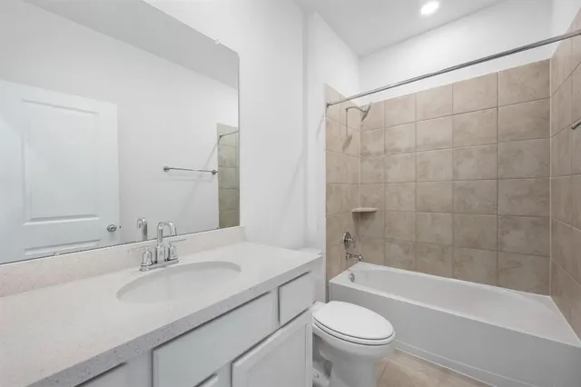 an aerial view of residential house with outdoor space and swimming pool