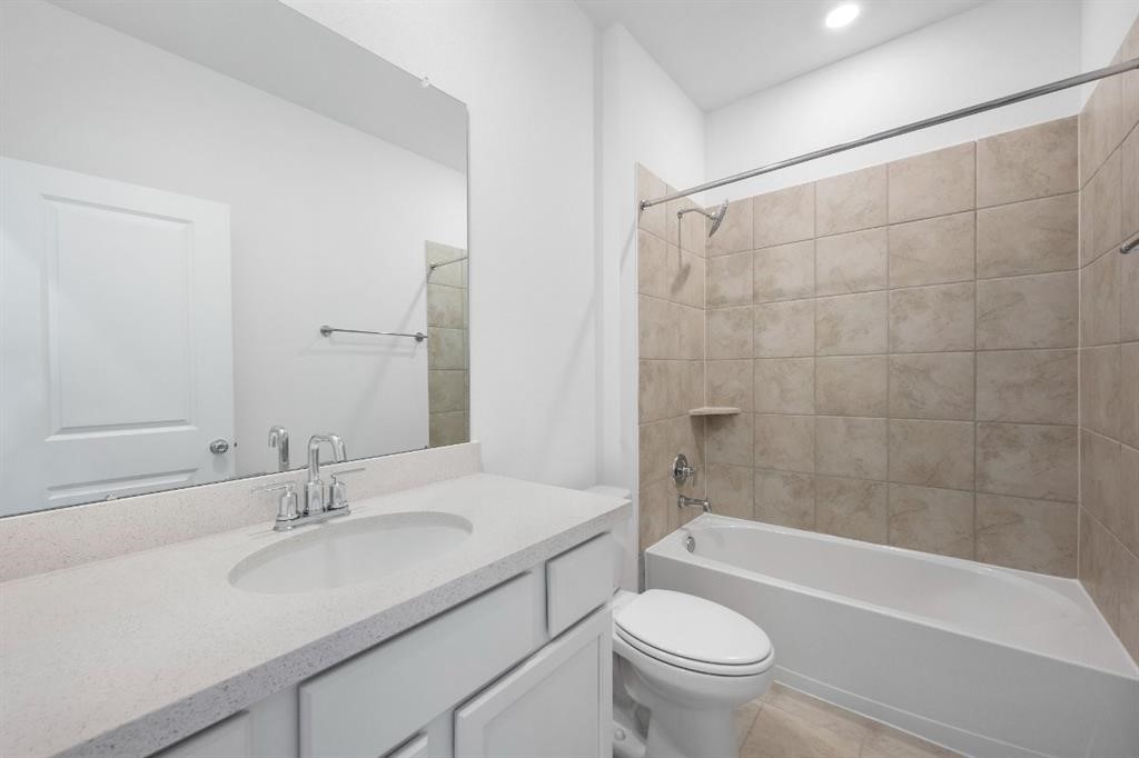 21918 Wycombe Terrace Way Cypress, TX 77433 - Photo 25 of 43 a bathroom with a sink a toilet and a bathtub