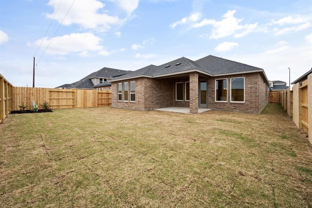 21918 Wycombe Terrace Way Cypress, TX 77433 - Photo 32 of 43 a view of a yard in front of a house with a large tree