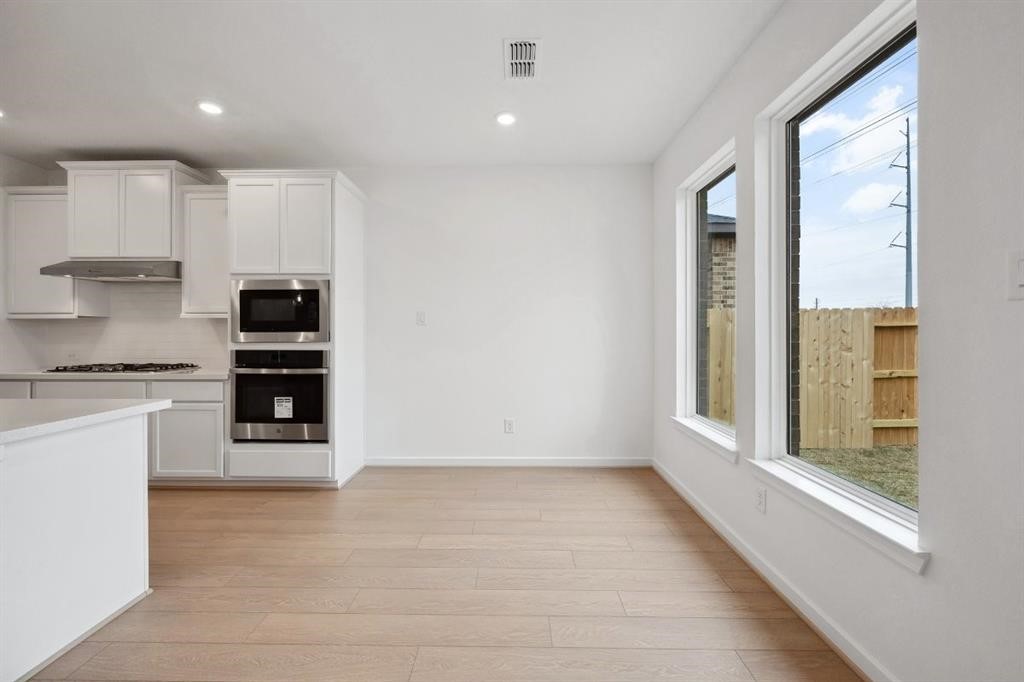 21918 Wycombe Terrace Way Cypress, TX 77433 - Photo 7 of 43 a view of kitchen with stainless steel appliances granite countertop a stove and a refrigerator