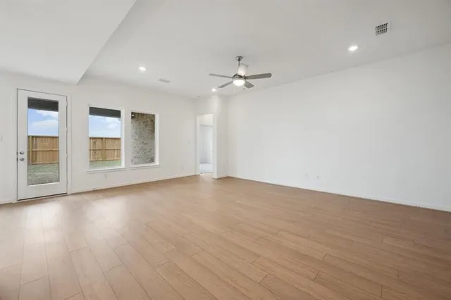 a large bathroom with a granite countertop sink a mirror and a shower