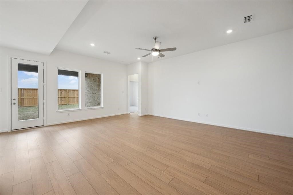 21918 Wycombe Terrace Way Cypress, TX 77433 - Photo 10 of 43 a view of empty room with wooden floor and fan