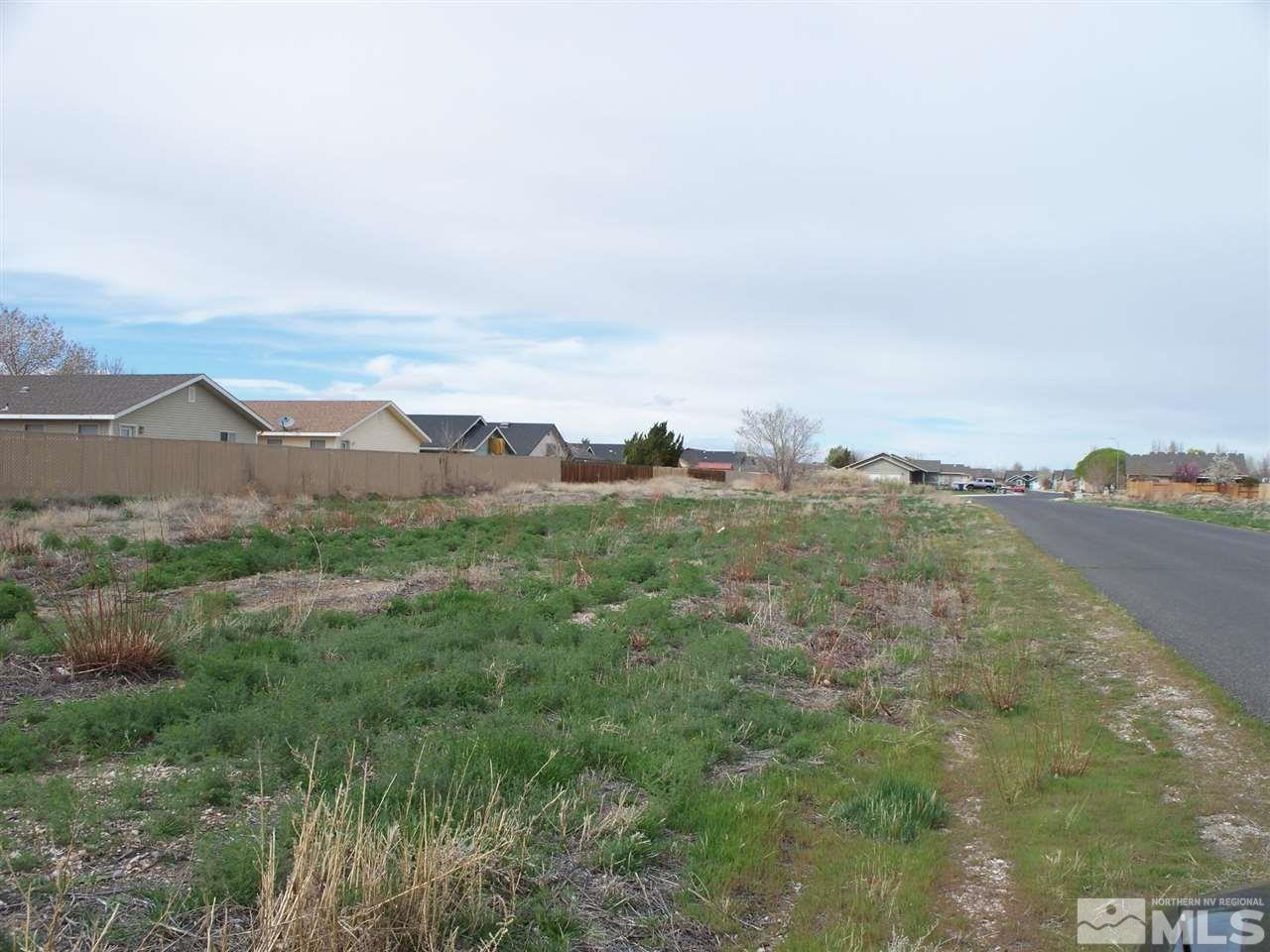 a view of a city with lush green forest