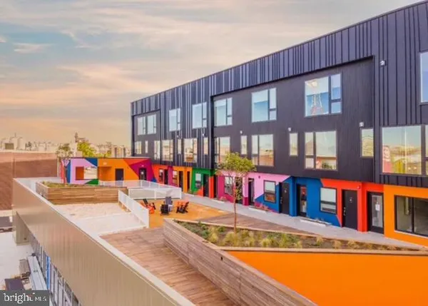 a view of a swimming pool with an outdoor seating