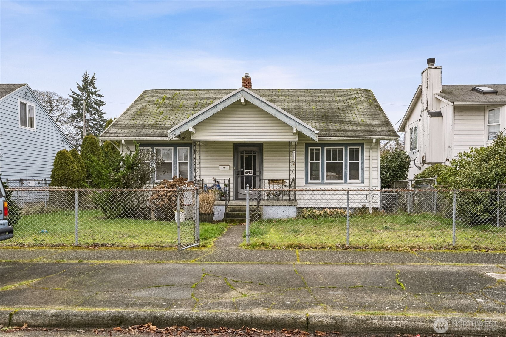a view of a house with a yard porch and sitting area