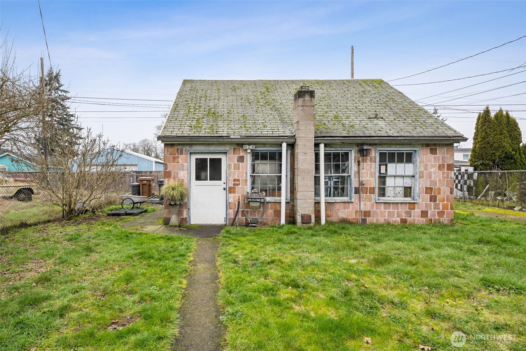 4912 South Prospect Street Tacoma, WA 98409 - Photo 14 of 16 a view of a house with a yard and sitting area