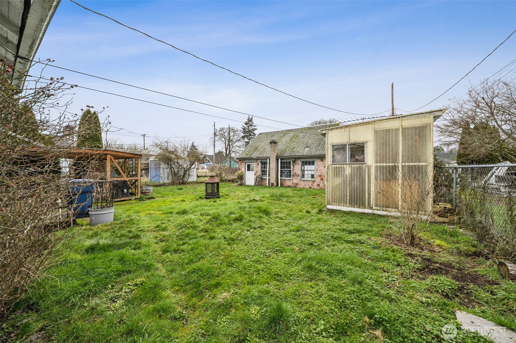 4912 South Prospect Street Tacoma, WA 98409 - Photo 15 of 16 a view of a house with a backyard