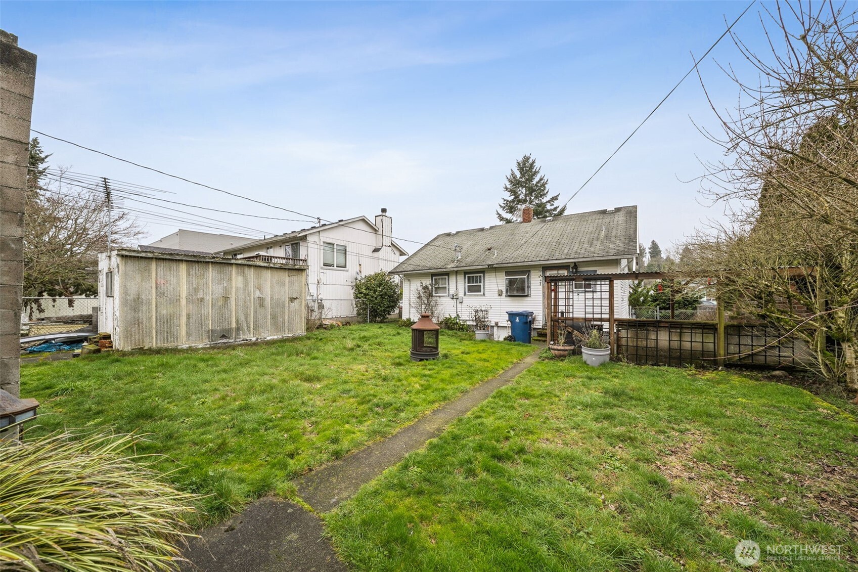 4912 South Prospect Street Tacoma, WA 98409 - Photo 16 of 16 a view of a house with a backyard