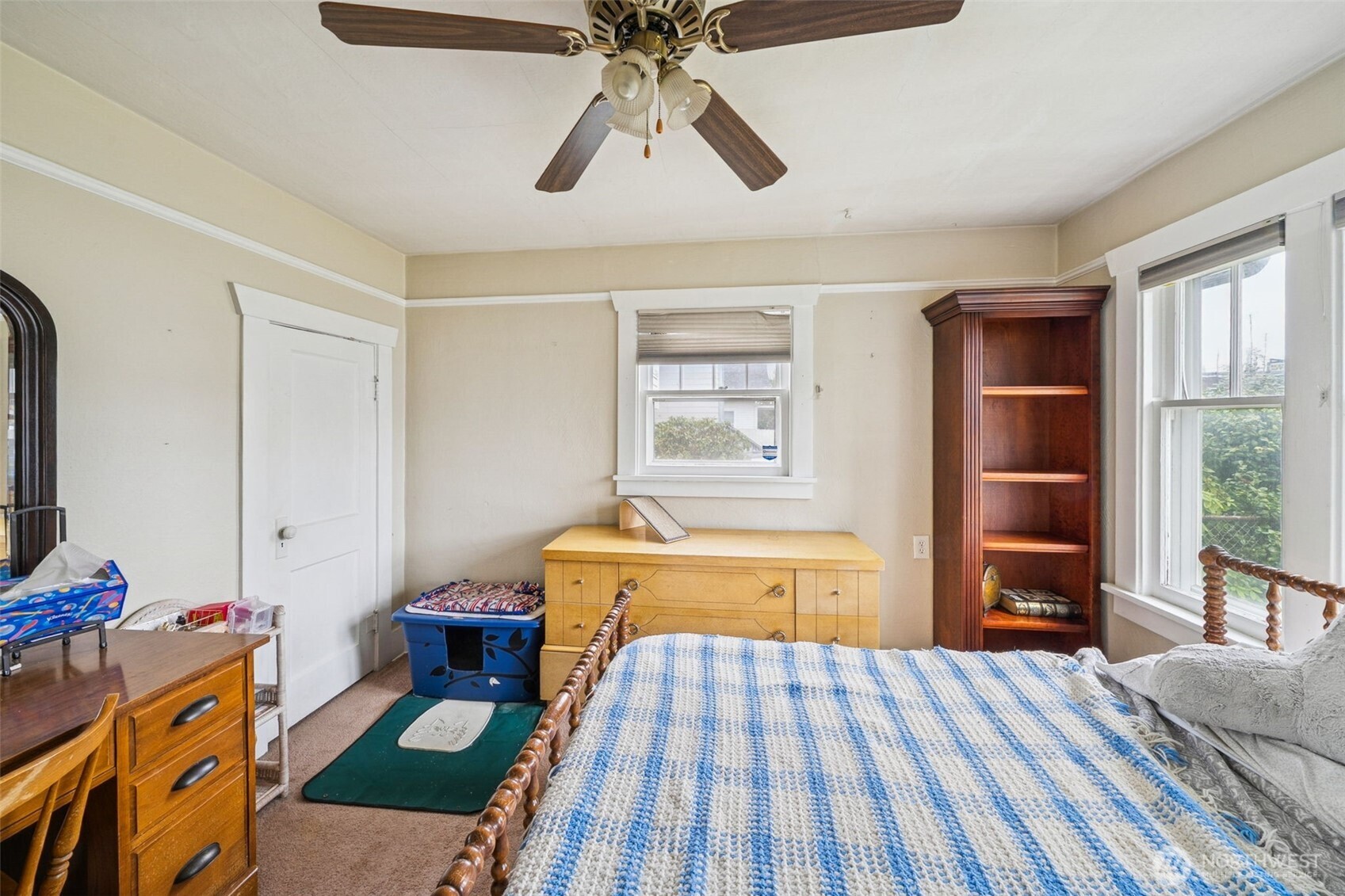4912 South Prospect Street Tacoma, WA 98409 - Photo 5 of 16 a bedroom with a bed and wooden floor