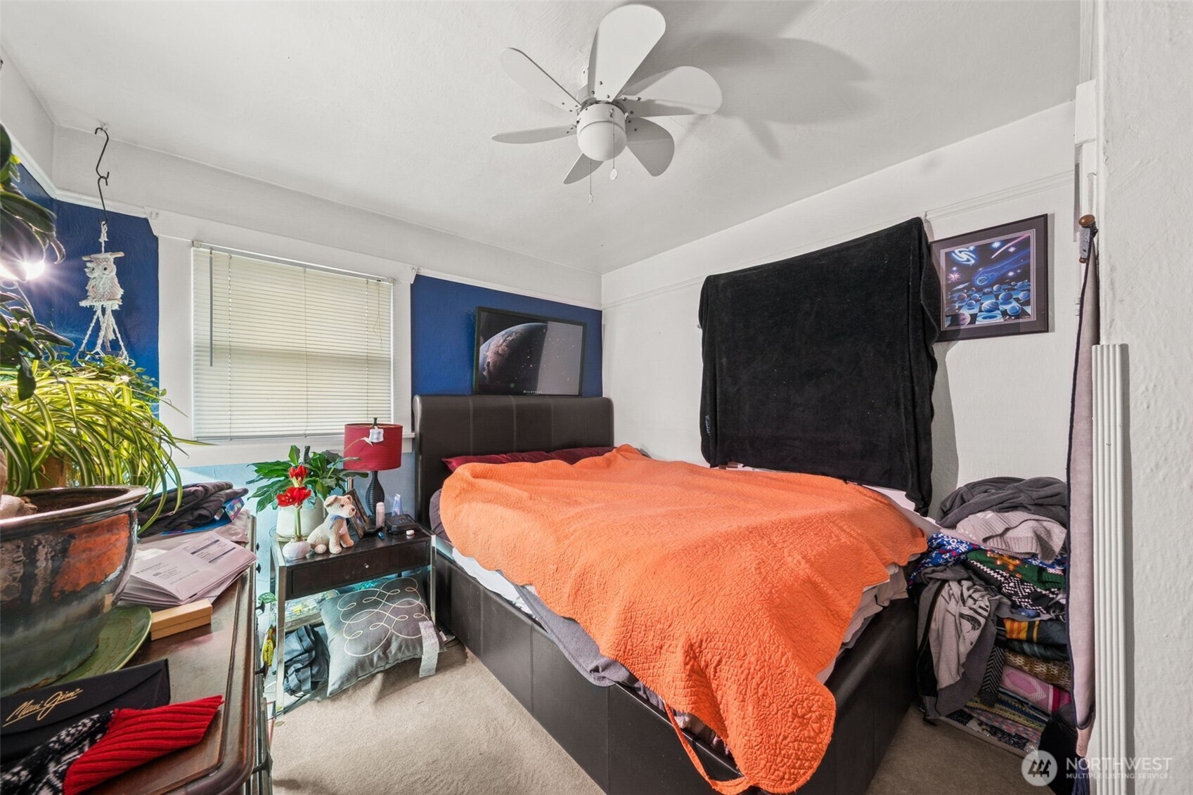 4912 South Prospect Street Tacoma, WA 98409 - Photo 8 of 16 a bed room with a bed and a potted plant